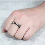 Women's Black Plated Stainless Steel Eternity Band with White Crystal Stones.